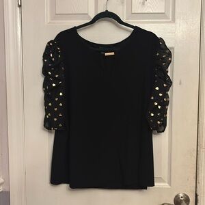 Black and gold, puffy sleeve blouse. With gold heart detail.